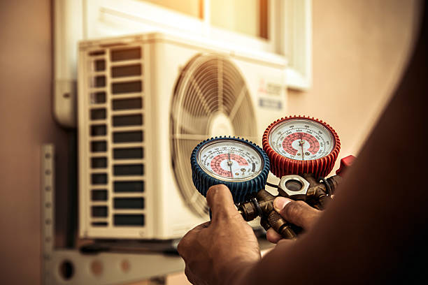 Professional Air Conditioning Service technician working in Grove City, FL